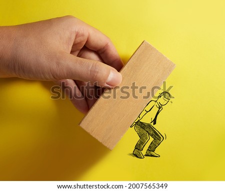 Hand drawn businessman carry a heavy wood block. Concept of stress. 