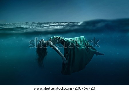 Woman floating underwater Royalty-Free Stock Photo #200756723