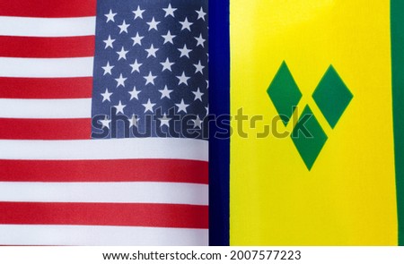 fragments of the national flags of the United States and Saint Vincent and the Grenadines close-up