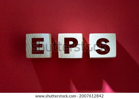 Word eps. Wooden small cubes with letters isolated on red background with copy space available