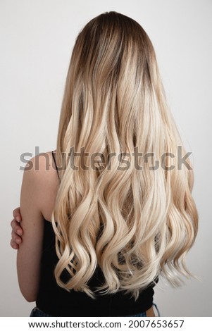 natural blonde hair in wig, ombre back view Royalty-Free Stock Photo #2007653657