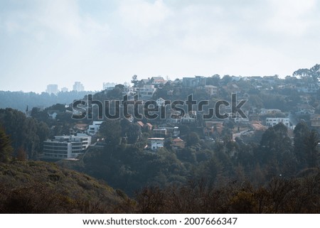 City between mountains with colorful houses
