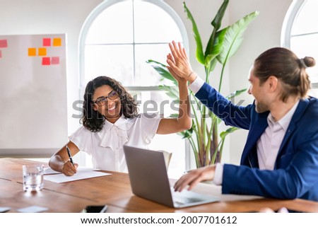 
Business people giving a high five