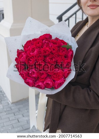 cute woman with red flowers 