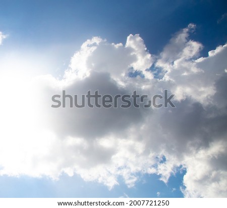 White clouds on a blue sky as a background.