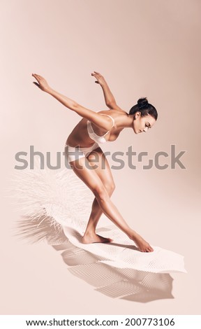 bending sepia woman on white feather