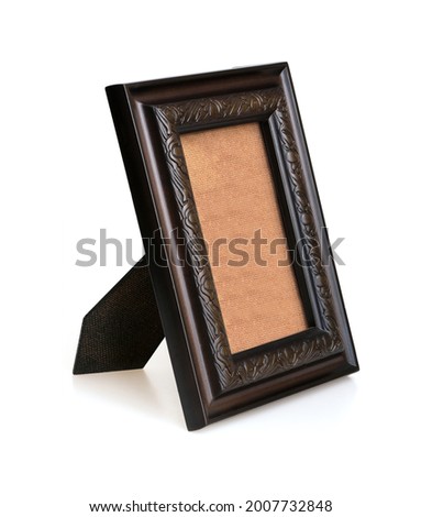Wooden frame for paintings, mirrors or photo in perspective view isolated on white background