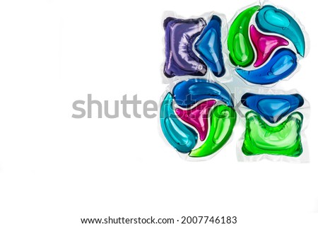 square capsules with colored gel for washing on a white background