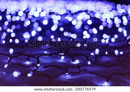 Christmas garland on a wall at night