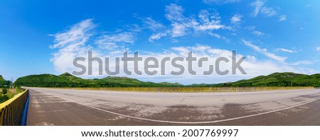 Highway landscape under the blue sky and white clouds on clear weather