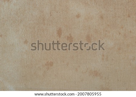 Delicate cream colored cloth surface with stains. for background and textured.