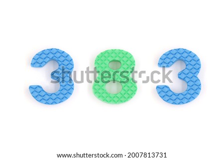 number 383 isolated on white background. Colorful letters on background close up. Alphabet toy. Number three hundred and eighty three.