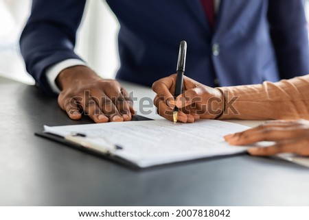 Contract Signing. Female Customer Sign Papers In Dealership Office, Unrecognizable African American Woman Client Buying New Car Or Purchasing Property, Closeup Shot, Cropped Image With Free Space