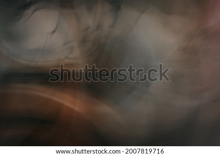 Abstract beige brown orange warm blurred background. Photo effect.