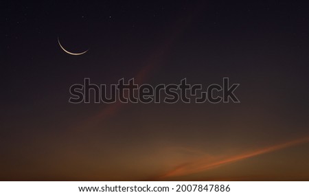 Crescent moon on twilight sky with religion of Islamic 