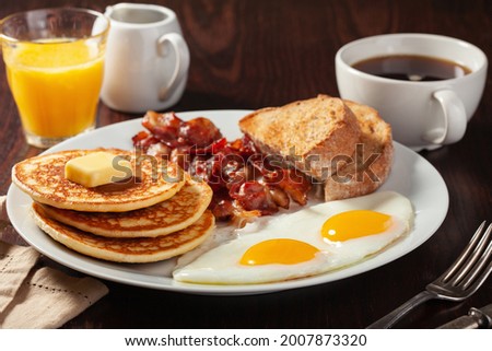 traditional full american breakfast eggs pancakes with bacon and toast Royalty-Free Stock Photo #2007873320