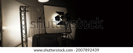 Studio light equipments for photo or film movie video. Light set for professional shooting studio background. LED Flood light and Spot light for video production studio. Setup Barn door and softbox.
