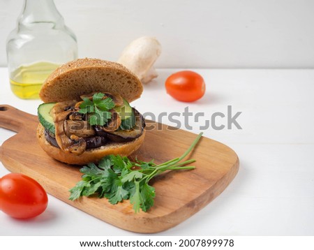 Vegetarian burgers made of eggplant, mushrooms, cucumbers, tomatoes and herbs.