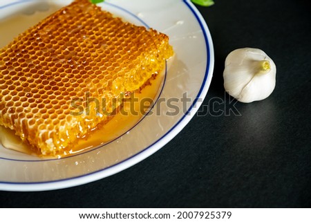 Bowl of honey in black background
