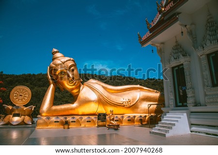 Wat Khao Sung Chaem Fa temple with giant snake and reclining gold buddha, in Kanchanaburi, Thailand Royalty-Free Stock Photo #2007940268