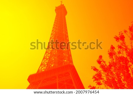 Abstract Eiffel tower with red and yellow color filter. Photo taken May 1st, 2019, Paris, France.