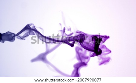 Isolated Purple Violet Ink Cloud floating in clear water. Macro Shot on White Background with selective focus framed for social media banner