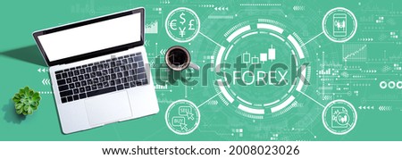 Forex trading concept with a laptop computer on a desk