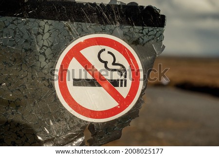 No smoking sign on a damage car glass, abstract car accident concept
