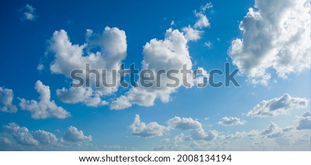 Blue Skys with Puffy White Clouds Royalty-Free Stock Photo #2008134194