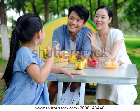 Happy family of three outdoor outings high quality photo