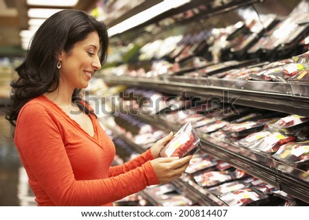Woman shopping in supermarket Royalty-Free Stock Photo #200814407