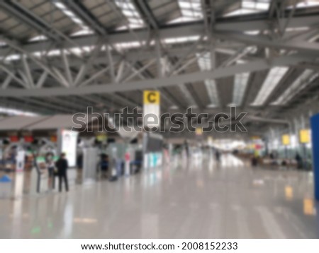 Abstract blurring image of airport terminal background. Travel passenger departure and arrival hall.