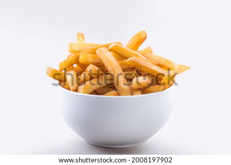 A bowl of crispy french fries isolated on white background.
 Royalty-Free Stock Photo #2008197902