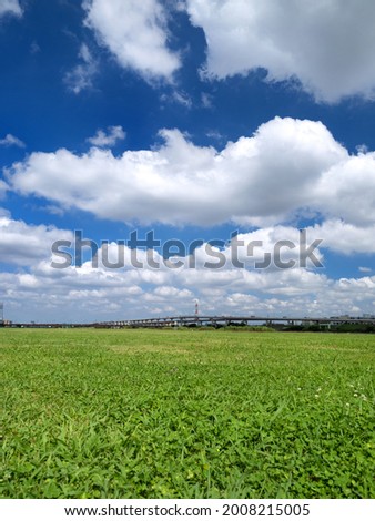 Early summer blue sky and meadow Royalty-Free Stock Photo #2008215005