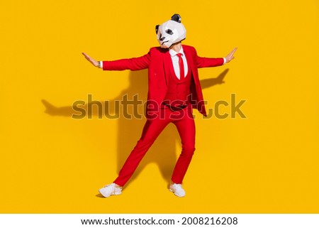 Photo of panda guy flirty boyfriend enjoy retro dance wear mask red tux tie shoes isolated on yellow color background