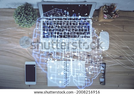 Multi exposure of brain sketch hologram over topview work table background with computer. Concept of big data.