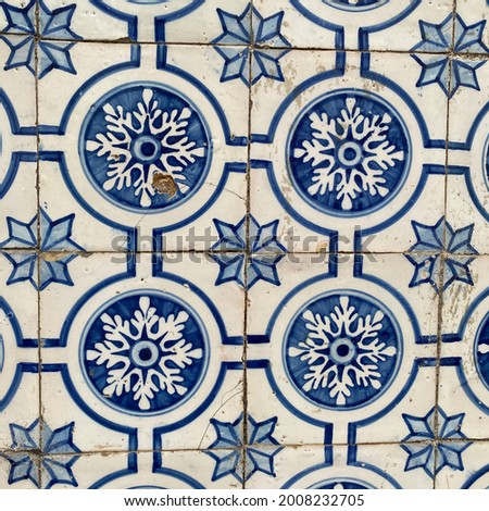 Traditional ornated portuguese ceramic tiles (azulejo) with beautiful old flower ornaments, classic floral decoration and colorful art pattern in retro style design, Lisbon (Lisboa), Portugal, Europe.