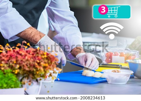 Food delivery service. Food delivery service from a restaurant. Logo with a shopping cart as a symbol of Food delivery on  internet. Chef is cooking something in background. Ordering products