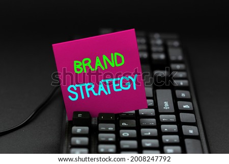 Conceptual caption Brand Strategy. Conceptual photo longterm plan executed for the development of a good product Creating Computer Programming Services, Typing New Worksheet Data