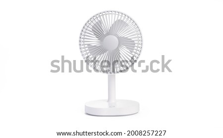 Battery powered white table fan isolated on white background with clipping path. portable battery fan Royalty-Free Stock Photo #2008257227
