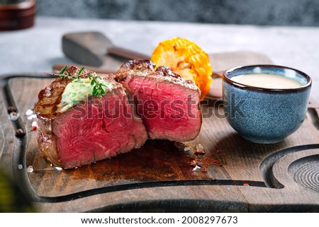 Filet Mignon steak, grilled medium rare. Sliced fried beef tenderloin close-up