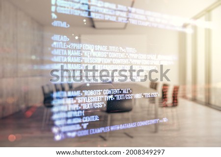 Multi exposure of abstract programming language hologram on a modern furnished office interior background, artificial intelligence and machine learning concept