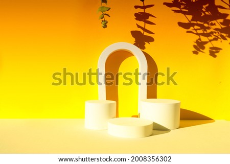 Minimal modern product display podium on textured gray and  yellow background with shadows overlay, toned