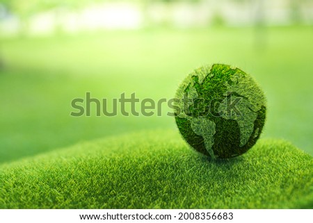 Close up earth on green background. protect nature.Save Earth.concept of the environment World Earth Day.
