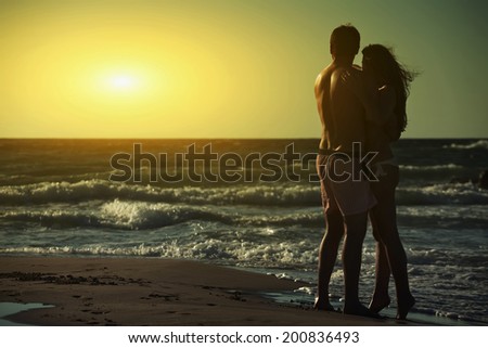 happy retired couple on the beach 