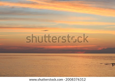 orange sunset in the evening on the sea 