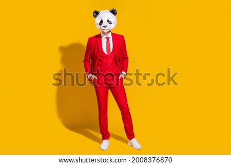 Photo of businessman panda guy hands pockets wear mask red suit tie footwear isolated on yellow color background Royalty-Free Stock Photo #2008376870