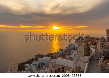 Sunset scenery of Santorini in Greece, Santorini is one of the Cyclades islands in the Aegean Sea, The whitewashed, cubiform houses of its 2 principal towns Royalty-Free Stock Photo #2008403585
