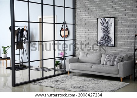 Stylish interior of modern hall in studio apartment Royalty-Free Stock Photo #2008427234