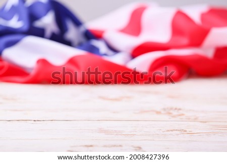 USA flag on light wooden table